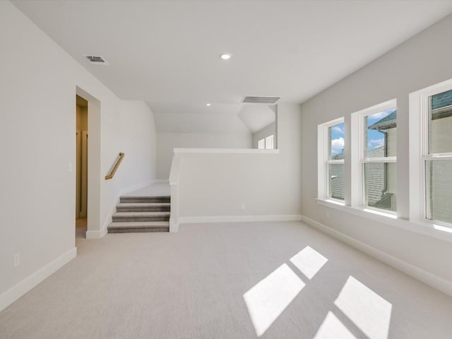 interior space with light carpet and plenty of natural light