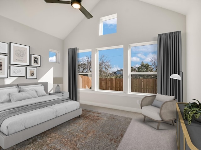 carpeted bedroom featuring ceiling fan, high vaulted ceiling, and multiple windows