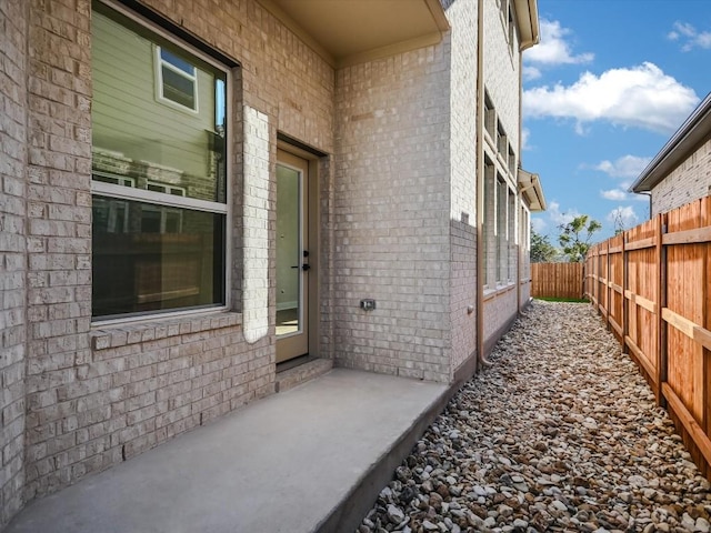 property entrance featuring a patio area