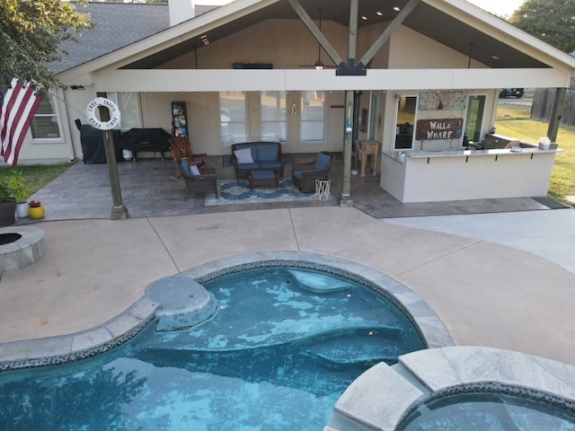 view of pool featuring an in ground hot tub and a patio area