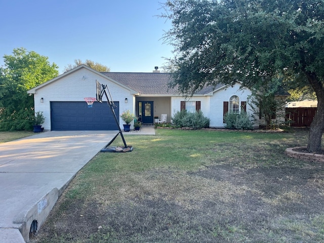 ranch-style home with a front yard and a garage