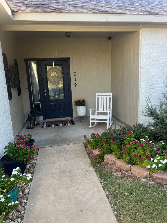 doorway to property featuring covered porch