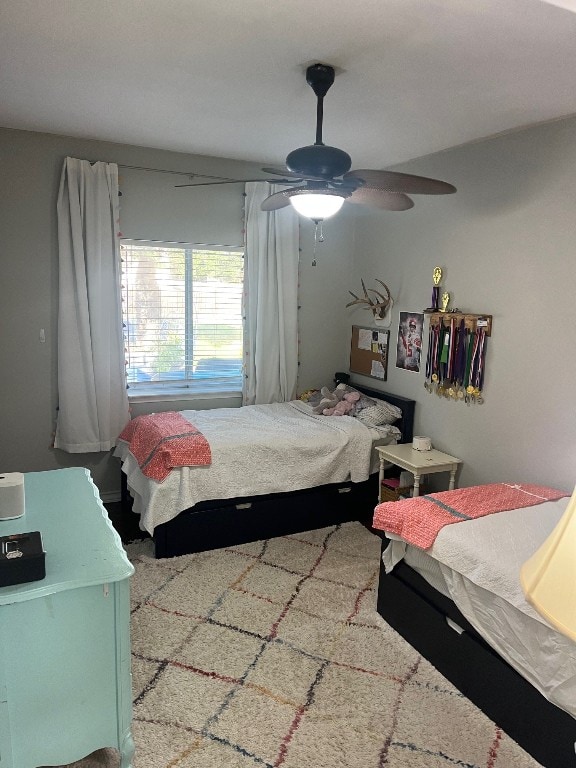 bedroom featuring ceiling fan and carpet floors