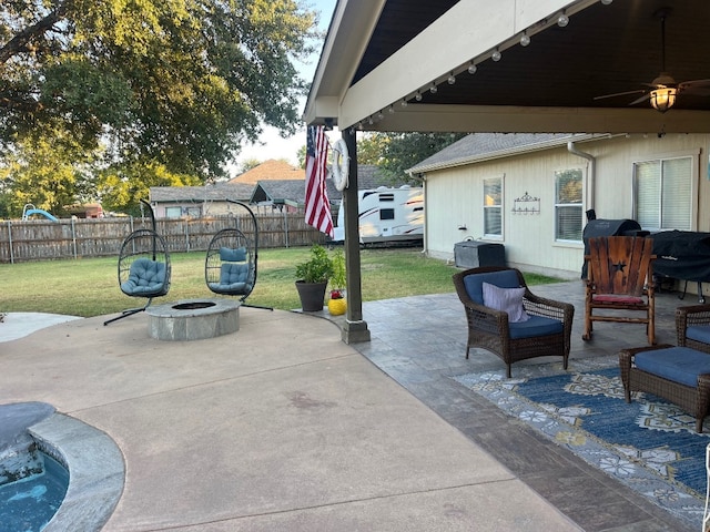 view of patio with an outdoor fire pit and ceiling fan