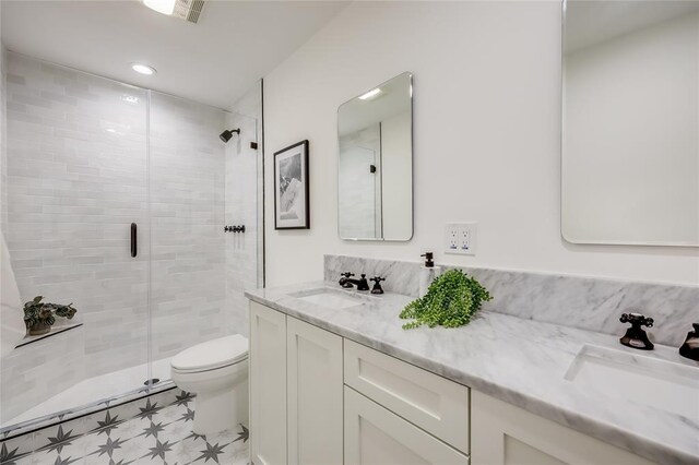 2900 Windsor Rd, Austin, TX 78703 - full bathroom featuring a stall shower, toilet, vanity, and tile patterned floors