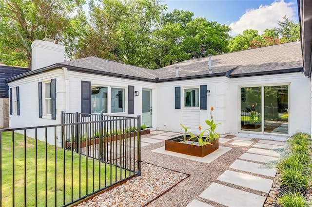 2900 Windsor Rd, Austin, TX 78703 - ranch-style house with a shingled roof and a chimney