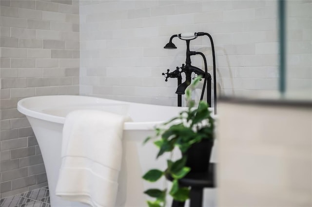 2900 Windsor Rd, Austin, TX 78703 - bathroom featuring a freestanding tub and tile walls