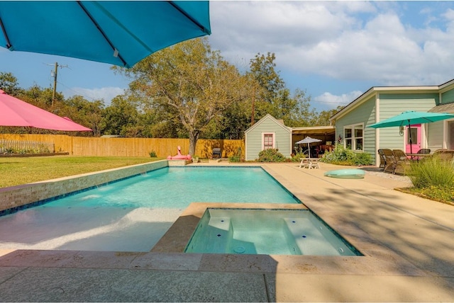 view of swimming pool with an in ground hot tub and a patio area