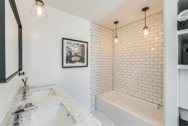 bathroom featuring vanity and tiled shower / bath combo