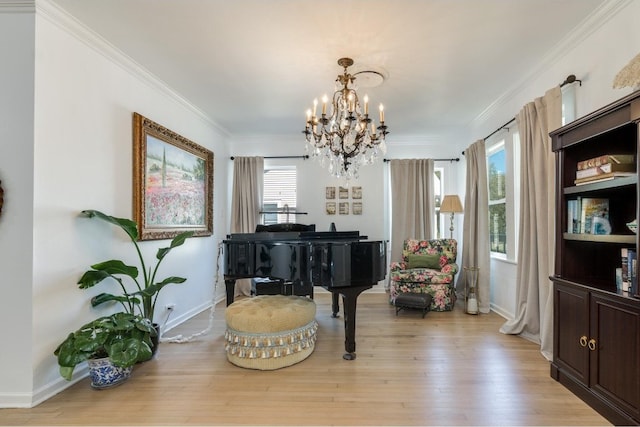 misc room featuring light hardwood / wood-style flooring, a notable chandelier, and crown molding