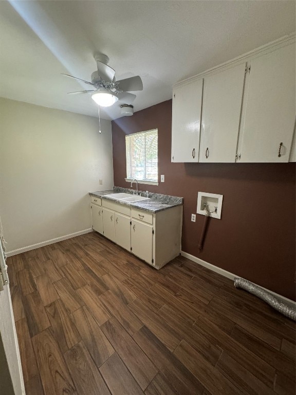 kitchen with sink, white cabinets, ceiling fan, and dark hardwood / wood-style flooring