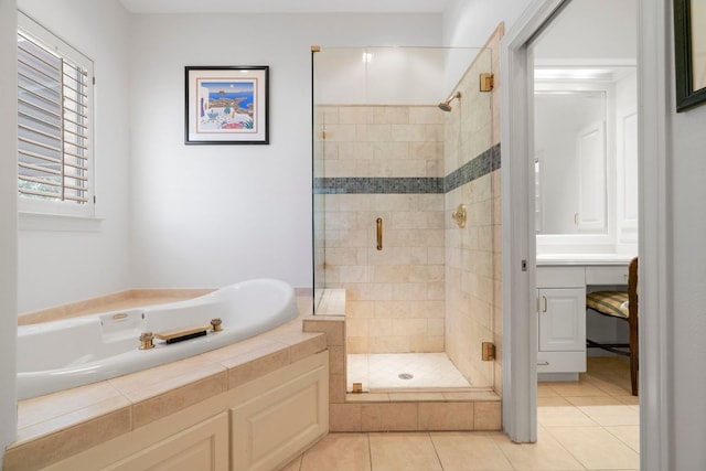 bathroom with tile patterned flooring, a shower stall, vanity, and a bath