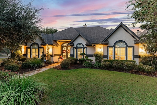 view of front of home featuring a yard