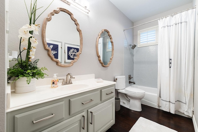 full bathroom featuring hardwood / wood-style flooring, toilet, shower / tub combo, and vanity