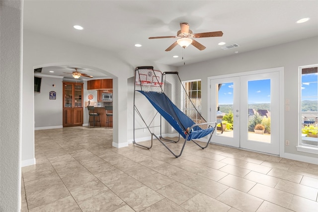 game room featuring french doors and ceiling fan