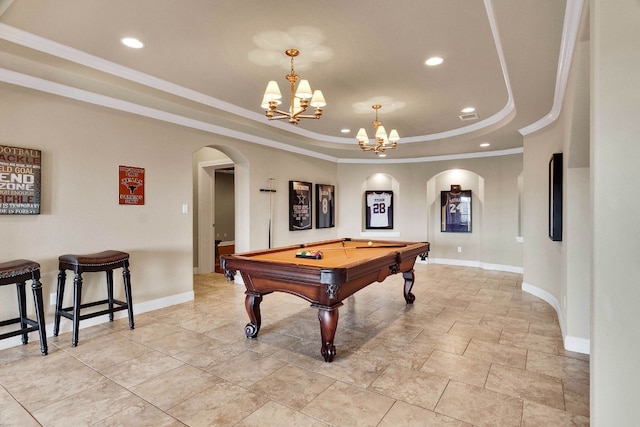 game room with ornamental molding, a chandelier, pool table, and a tray ceiling