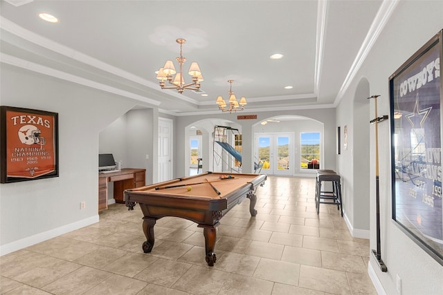 playroom featuring french doors, a raised ceiling, crown molding, a notable chandelier, and billiards