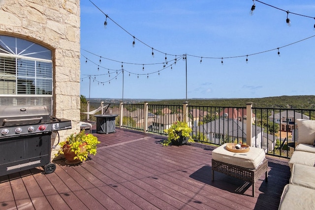 wooden deck featuring grilling area