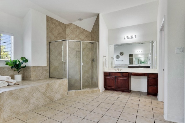 bathroom featuring vanity, tile patterned flooring, and a shower with door