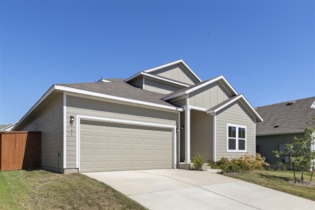 view of front facade with a front lawn and a garage