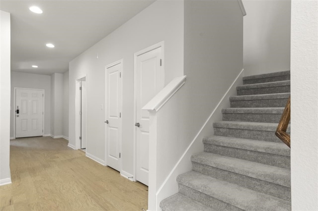 stairway featuring hardwood / wood-style floors