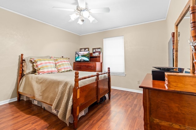 bedroom with dark hardwood / wood-style flooring, crown molding, and ceiling fan