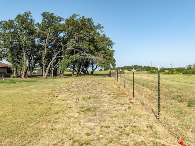 view of yard with a rural view