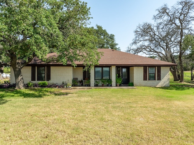 ranch-style house with a front lawn