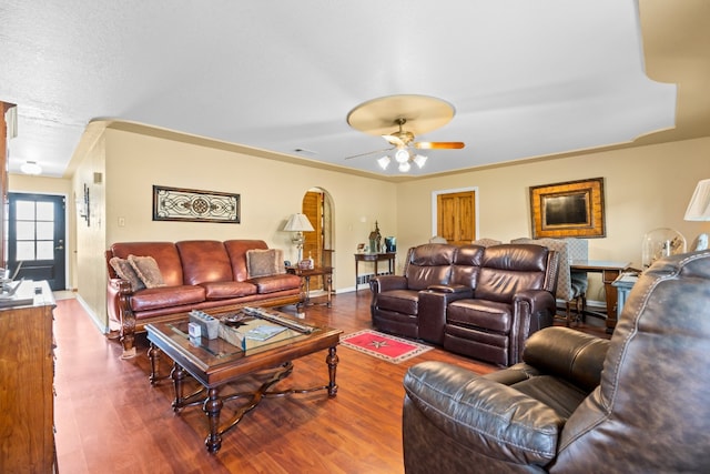 living room featuring hardwood / wood-style flooring and ceiling fan