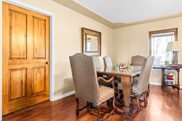 dining area featuring dark hardwood / wood-style floors