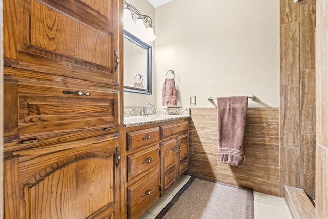 bathroom with vanity, a shower, and tile patterned floors