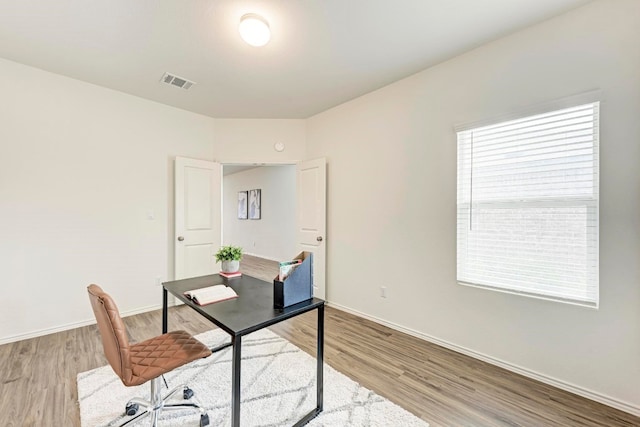 office area with light hardwood / wood-style flooring