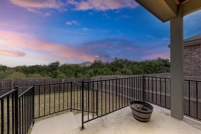 view of balcony at dusk