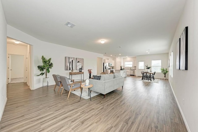 living room with light hardwood / wood-style flooring