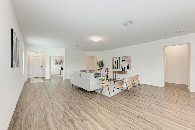 living room with light hardwood / wood-style flooring