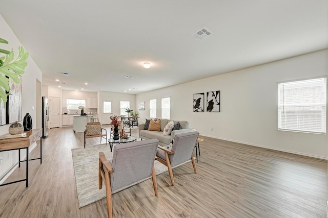 living room with light hardwood / wood-style floors