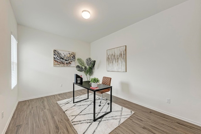 office area with wood-type flooring