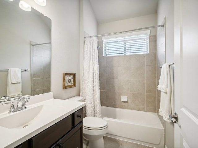 full bathroom featuring tile patterned floors, vanity, shower / bath combination with curtain, and toilet