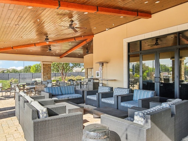 view of patio featuring ceiling fan, an outdoor hangout area, and french doors