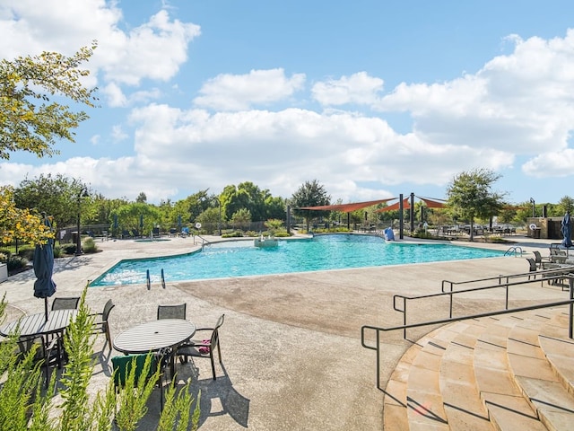 view of swimming pool featuring a patio area