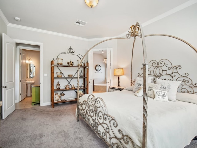 carpeted bedroom featuring connected bathroom, sink, and ornamental molding