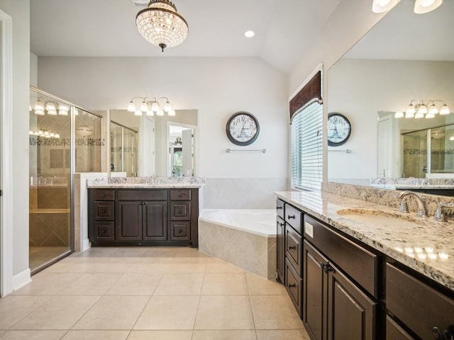 bathroom featuring plus walk in shower, vanity, tile patterned flooring, and lofted ceiling