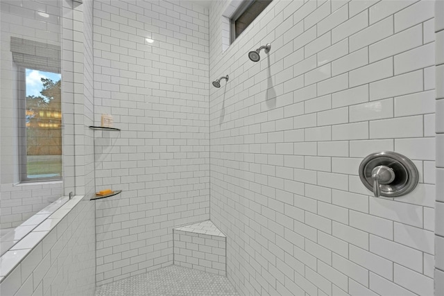 bathroom with tiled shower