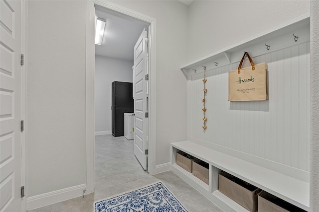 mudroom featuring light tile patterned flooring