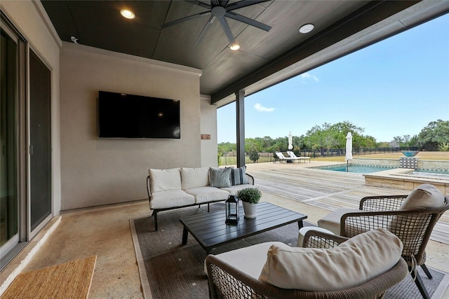 view of patio / terrace with ceiling fan and an outdoor living space