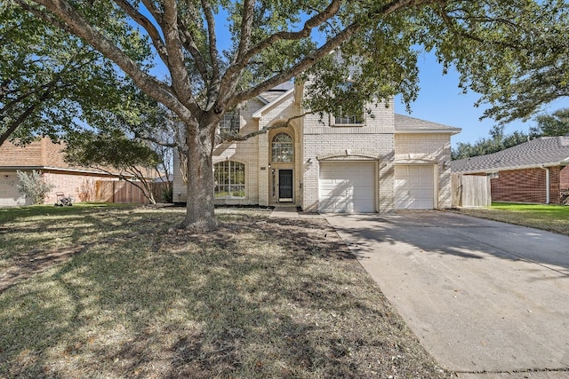 view of front of property featuring a garage and a front lawn