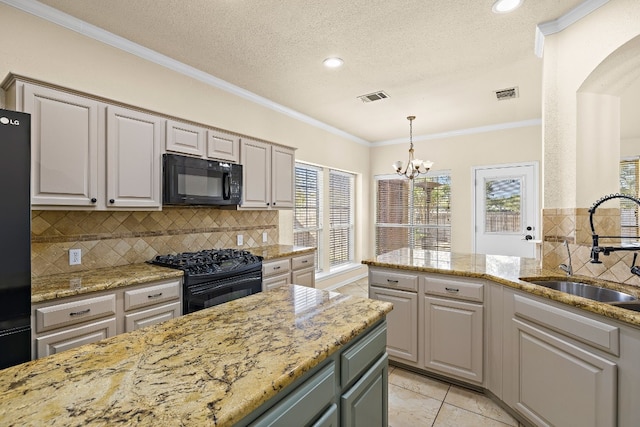 kitchen with black appliances, sink, a textured ceiling, crown molding, and a notable chandelier