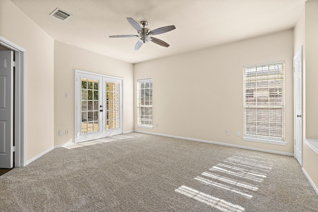 unfurnished room featuring french doors, carpet, and a healthy amount of sunlight