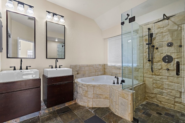 bathroom with vanity, vaulted ceiling, and shower with separate bathtub