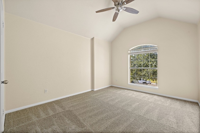 unfurnished room featuring ceiling fan, carpet flooring, and vaulted ceiling